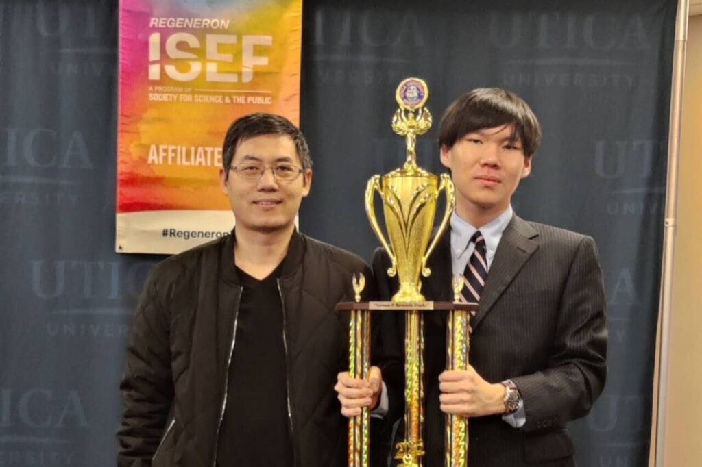 Dr. Lin and Richard Xu holding trophy